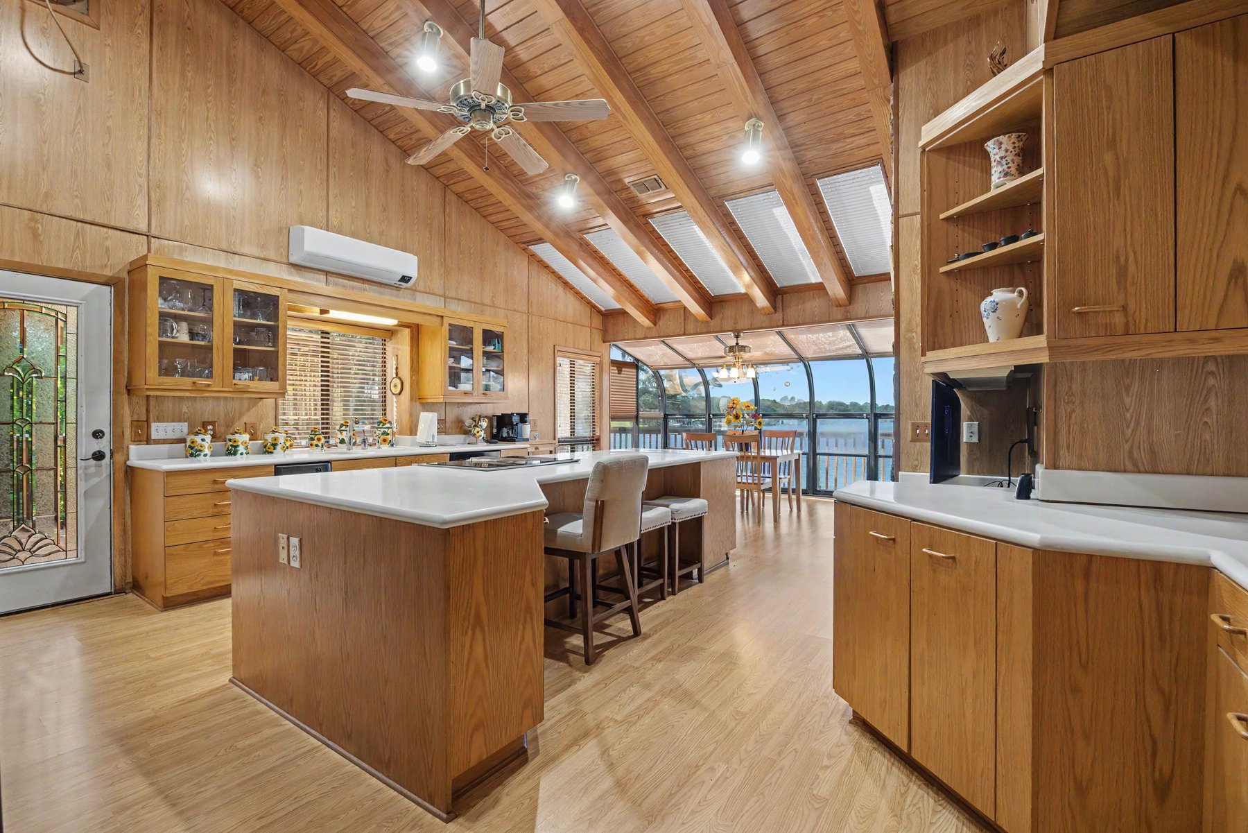Lakefront kitchen with cedar vaulted ceiling and water view — a recent listing from Roy's portfolio